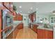 Spacious kitchen featuring stainless steel appliances, granite countertops and wood cabinets at 145 Billowing Sails St, Summerville, SC 29486