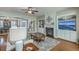 Inviting living room with fireplace, built-in shelves, and a view of the dining area, bathed in natural light at 145 Billowing Sails St, Summerville, SC 29486