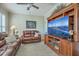 Comfortable living room featuring a large entertainment center and plush leather seating at 145 Billowing Sails St, Summerville, SC 29486