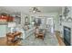 Spacious living room seamlessly connecting to kitchen, offering a comfortable open-concept living space at 145 Billowing Sails St, Summerville, SC 29486