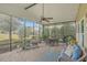 Relaxing screened porch with comfortable seating and views of the lush backyard landscaping at 145 Billowing Sails St, Summerville, SC 29486