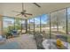 Charming screened porch offering tranquil water views, making it a perfect space for relaxation and enjoyment at 145 Billowing Sails St, Summerville, SC 29486