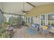 Inviting screened porch with cozy seating, perfect for enjoying the outdoors in comfort and style at 145 Billowing Sails St, Summerville, SC 29486