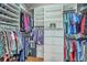 Spacious walk-in closet featuring custom shelving, hanging rods, and built-in storage for organization at 145 Billowing Sails St, Summerville, SC 29486