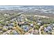 Breathtaking aerial view of charming neighborhood homes nestled amongst lush trees and a scenic pond nearby the waterway at 1501 Sea Palms Cres, Mount Pleasant, SC 29464