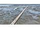 Expansive aerial view of a long highway stretching across a marshland landscape under a clear sky at 1501 Sea Palms Cres, Mount Pleasant, SC 29464