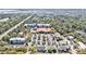 Aerial view of shopping area and major highway, with lush greenery and blue sky in the background at 1501 Sea Palms Cres, Mount Pleasant, SC 29464
