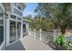 Relaxing balcony overlooking lush greenery, complete with outdoor seating for enjoying the scenic views at 1501 Sea Palms Cres, Mount Pleasant, SC 29464