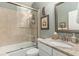 Well-lit bathroom featuring a tiled shower, granite-topped vanity, and elegant fixtures for a spa-like feel at 1501 Sea Palms Cres, Mount Pleasant, SC 29464