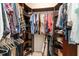 Walk-in closet with wooden shelving and hanging rods, offering ample storage for clothing and accessories at 1501 Sea Palms Cres, Mount Pleasant, SC 29464