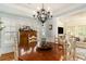 Dining room with a rustic wood table, chandelier, and views of the living room at 1501 Sea Palms Cres, Mount Pleasant, SC 29464
