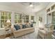 Sunroom boasts a comfortable seating area with lots of natural light and tranquil views at 1501 Sea Palms Cres, Mount Pleasant, SC 29464