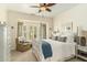 Serene bedroom with four-poster bed, large windows, and neutral decor at 1501 Sea Palms Cres, Mount Pleasant, SC 29464