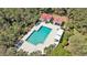 Aerial view of a community pool with a red-roofed pavilion, surrounded by lush greenery at 1501 Sea Palms Cres, Mount Pleasant, SC 29464