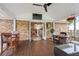 Cozy back porch with a ceiling fan, wood floors, and access to the kitchen with an outdoor dining area at 1515 Wakendaw Rd, Mount Pleasant, SC 29464