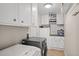 Laundry room featuring plenty of cabinet space, washer, and dryer at 1515 Wakendaw Rd, Mount Pleasant, SC 29464
