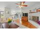 Open-concept living space with a fireplace and seamless connection to a modern kitchen and dining area at 1515 Wakendaw Rd, Mount Pleasant, SC 29464