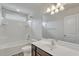Bathroom with white tile, modern vanity, mirror, and shower-tub combo at 154 Old Jackson Rd, Goose Creek, SC 29445