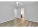 Bedroom with view of an open doorway, neutral walls, wood-look flooring, and a ceiling fan at 154 Old Jackson Rd, Goose Creek, SC 29445