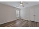 Bright bedroom featuring neutral walls, wood-look flooring, a ceiling fan and double-door closet at 154 Old Jackson Rd, Goose Creek, SC 29445