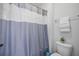 Clean bathroom featuring a shower with curtain, toilet, and neutral tones at 158 Netherfield Dr, Summerville, SC 29486