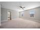 Spacious bedroom featuring neutral colors, a ceiling fan, and lots of natural light from two windows at 158 Netherfield Dr, Summerville, SC 29486