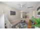 Spacious bonus room with a stylish rug, comfortable seating, and ample natural light at 158 Netherfield Dr, Summerville, SC 29486