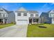 Charming two-story home with a well-manicured lawn, a two-car garage, and neutral siding at 158 Netherfield Dr, Summerville, SC 29486