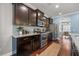 Kitchen featuring stainless appliances, granite counters, hardwood floors and dark wood cabinets at 158 Netherfield Dr, Summerville, SC 29486