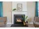 Cozy living room with a fireplace, stylish mantel and decor, and plush seating at 158 Netherfield Dr, Summerville, SC 29486