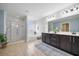 Bright main bathroom with double vanity, glass shower, and soaking tub with natural light at 158 Netherfield Dr, Summerville, SC 29486