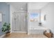 Bright bathroom featuring a glass shower and a soaking tub with natural light at 158 Netherfield Dr, Summerville, SC 29486