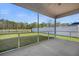 View of the screened patio offering an outdoor living space with a view of the backyard and fence at 158 Netherfield Dr, Summerville, SC 29486