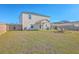 Spacious backyard featuring a fire pit area and ample green space for outdoor activities at 159 Lucky Day Dr, Summerville, SC 29486
