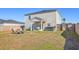 A spacious backyard with a patio set, hot tub, and well-maintained lawn at 159 Lucky Day Dr, Summerville, SC 29486