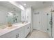 Bright bathroom featuring double sinks with gold fixtures and a glass enclosed shower at 159 Lucky Day Dr, Summerville, SC 29486