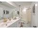 Well-lit bathroom featuring white cabinets, a large mirror, and neutral decor at 159 Lucky Day Dr, Summerville, SC 29486