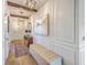 Elegant entryway featuring paneled walls, wood floors, and stylish lighting at 159 Lucky Day Dr, Summerville, SC 29486