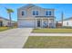 Charming two-story home with a well-manicured lawn and welcoming front porch at 159 Lucky Day Dr, Summerville, SC 29486