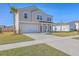 Attractive two-story home featuring a covered front porch and attached two-car garage at 159 Lucky Day Dr, Summerville, SC 29486