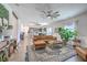Spacious living room featuring a large area rug, a ceiling fan, and plenty of seating at 159 Lucky Day Dr, Summerville, SC 29486