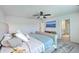 Bright main bedroom featuring a bed, ceiling fan, and view into the bathroom at 159 Lucky Day Dr, Summerville, SC 29486