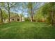 Large, well-maintained backyard with a grassy lawn and mature trees, offering privacy and ample space for recreation at 160 Mickler Dr, Ladson, SC 29456