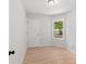 Bright bedroom featuring hardwood floors and a window with a view of the outdoors at 160 Mickler Dr, Ladson, SC 29456