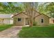 Charming single-story home featuring a well-maintained lawn and mature trees for curb appeal at 160 Mickler Dr, Ladson, SC 29456