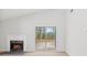 Bright living room featuring a fireplace and sliding glass doors to the outdoor patio at 160 Mickler Dr, Ladson, SC 29456
