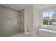 Luxurious bathroom with soaking tub, walk-in shower, dual shower heads and sleek, modern design at 1615 Macoma Rd, Mount Pleasant, SC 29466