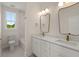 Bathroom featuring a double sink vanity with modern fixtures and a separate tub and shower at 1615 Macoma Rd, Mount Pleasant, SC 29466