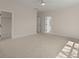 Spacious bedroom with neutral tones, including a ceiling fan and doorways to other rooms at 1615 Macoma Rd, Mount Pleasant, SC 29466