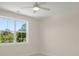 Light-filled bedroom with a large window offering an outdoor view and a ceiling fan at 1615 Macoma Rd, Mount Pleasant, SC 29466